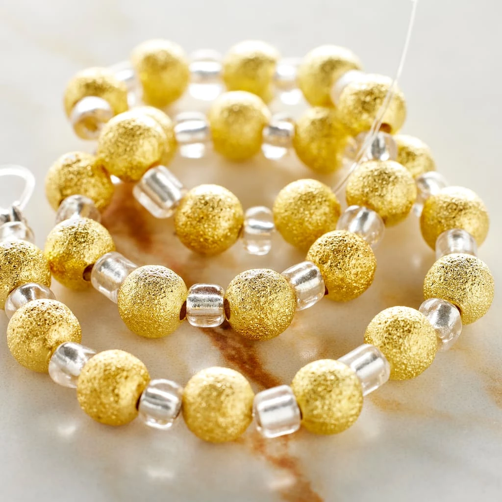 Wholesale 𧨠Bead Gallery® Gold Stardust Metal Round Beads, 6mm π - Image 2